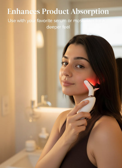 The Glow Lab anti-wrinkle facial toning device with red light therapy being used on a woman's cheek in a bathroom.